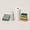 Household cleaning supplies including cloth, spray bottle, paper towel and sponges