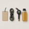 Car accessories including an air freshener card, cable, tyre gauge and fluid bottle