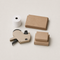 Store counter supplies including receipt paper, a price gun and boxes
